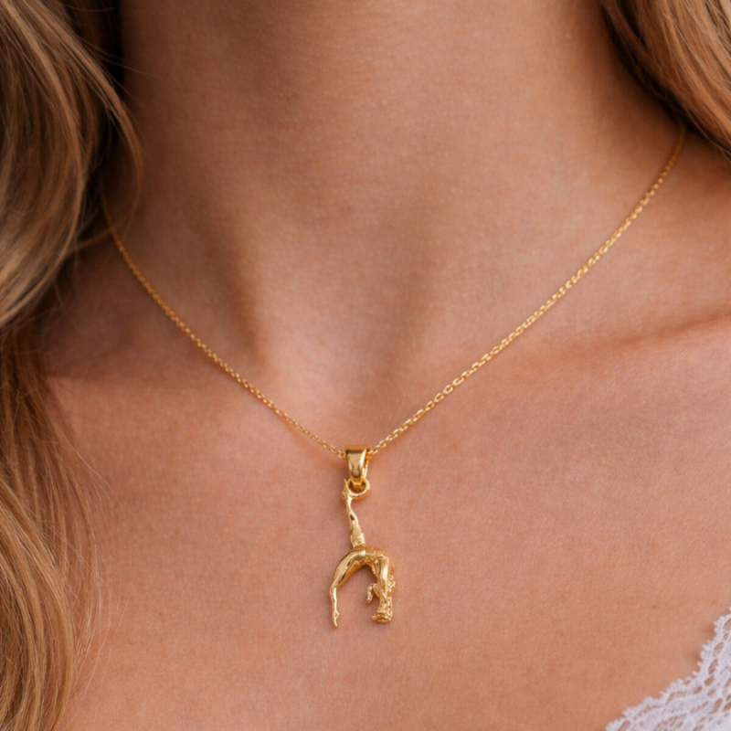 Pendentif figure gymnaste or